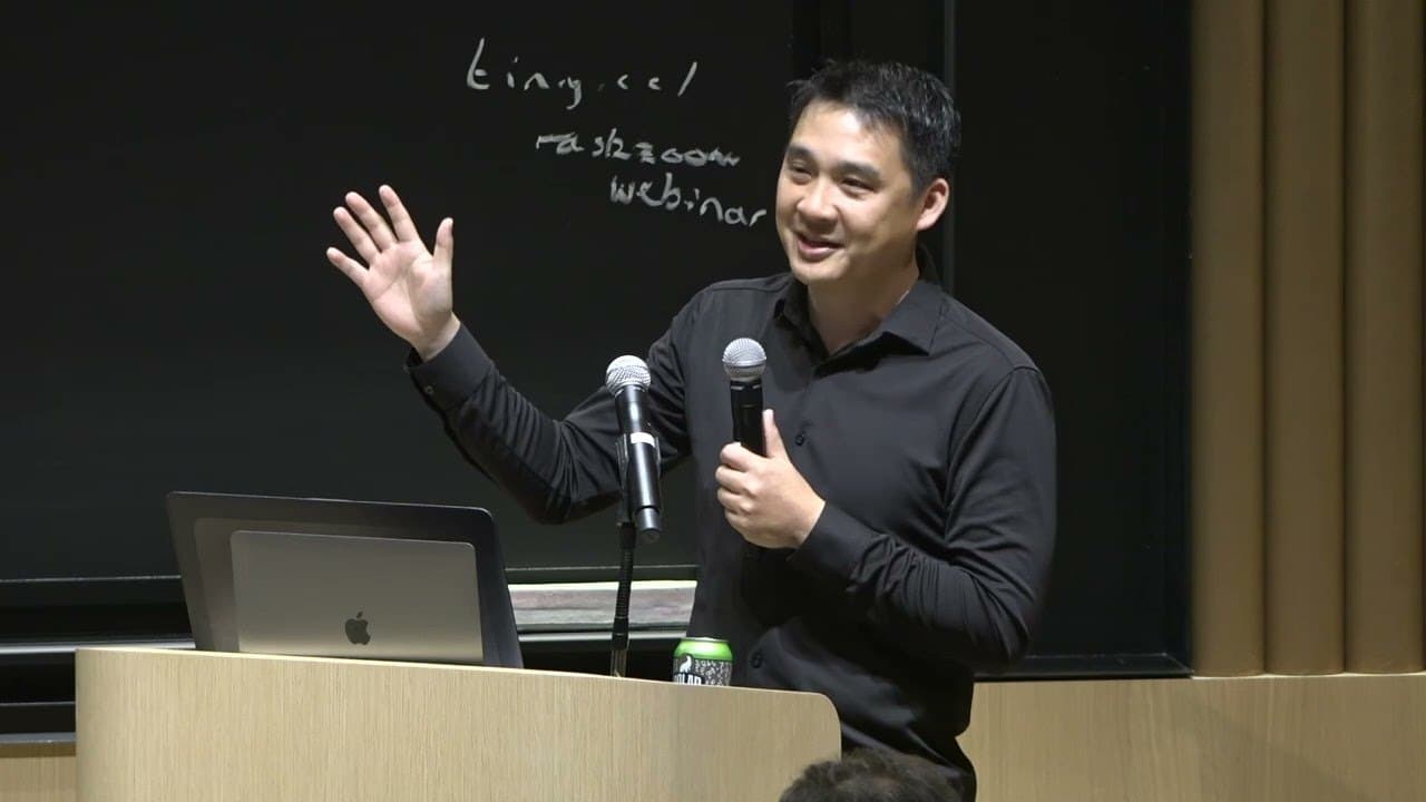 James Chen speaking at a podium at Project Nanda, July 2025.